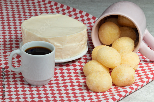 Cheese bread, Brazilian typical snack, with cup of coffee.