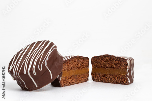 Two halves and a whole honey cookies with chocolate named pão de mel, Brazilian dessert.