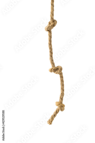 The end of the rope with three knots is isolated on a white background.