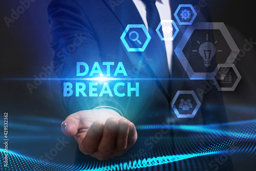 Business, Technology, Internet and network concept. Young businessman working on a virtual screen of the future and sees the inscription: Data breach