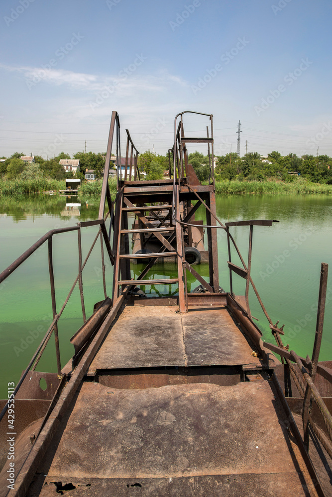Fragment of a pedestrian metal bridge over the Sura river in the Dnipropetrovsk region in Ukraine Fragment of a pedestrian metal bridge over the Sura river in the Dnipropetrovsk region in Ukraine