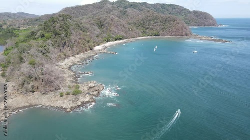 Tambor Beach in Peninusla de Nicoya, Costa Rica - Tropical Paradise Beach lined with palm trees	 photo