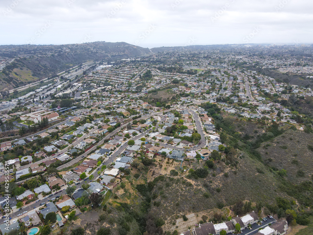 Aerial view of Balboa neighborhood with houses and residential condos during clouded day in San Diego, California, USA.
