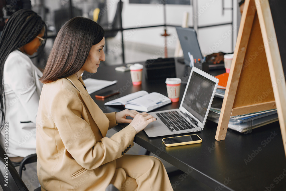 Business multi racial women working in the office Business multi racial women working in the office