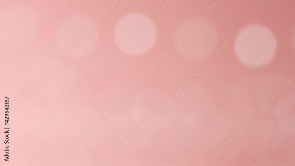 Blurred moving pink color light particles, lens flare, bokeh abstract background
