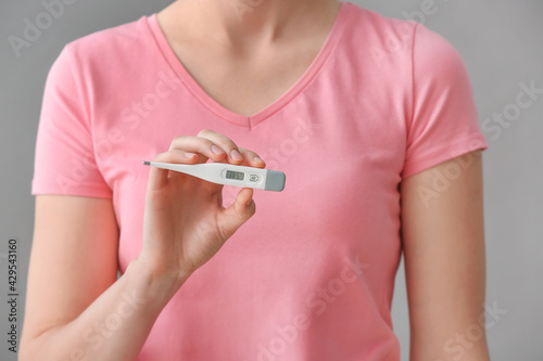 Woman with electronic therm...