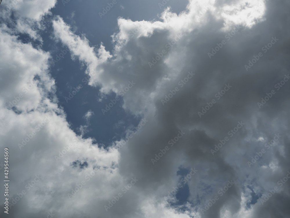 Cumulonimbus cloud formations on tropical blue sky , Nimbus moving , Abstract background from natural phenomenon and gray clouds hunk , Thailand Cumulonimbus cloud formations on tropical blue sky , Nimbus moving , Abstract background from natural phenomenon and gray clouds hunk , Thailand