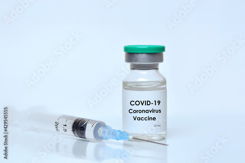 Coronavirus vaccine vial, syringe on white background.The concept of medicine, healthcare and science.Coronavirus vaccine.Copy space for text..