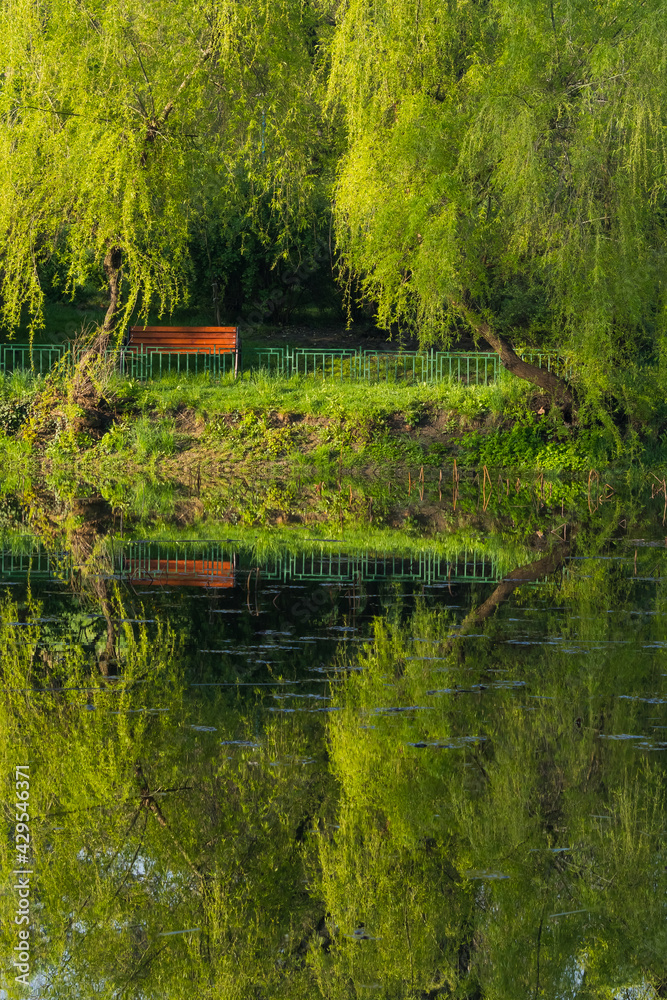 Beautiful Reflections onto the Lake Surface in the First Morning Hours Beautiful Reflections onto the Lake Surface in the First Morning Hours