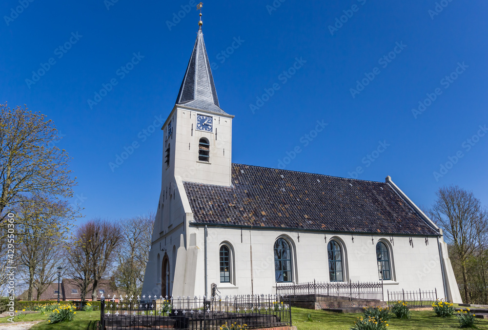 Little white church in historic village Vierhuizen