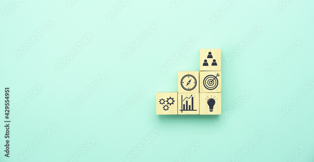Top view of wood block with business and finance icon background concept. Human resource management, Strategy target planning , Success and synergy plan, Innovation creative new idea financial. Top view of wood block with business and finance icon background concept. Human resource management, Strategy target planning , Success and synergy plan, Innovation creative new idea financial.