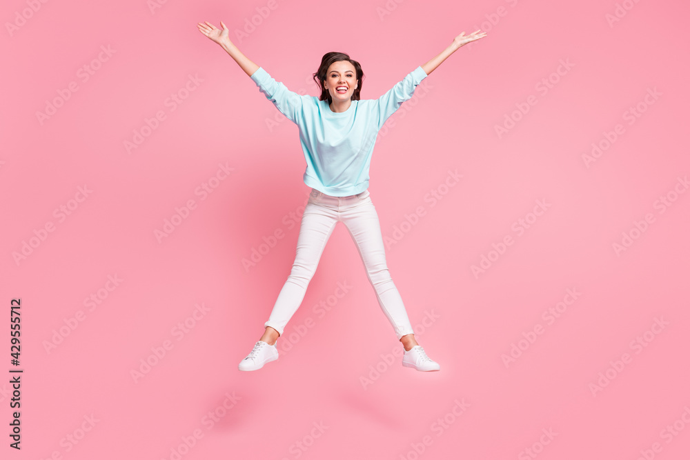 Full body photo of charming person jumping enjoy weekend wear white blue isolated on pink color background