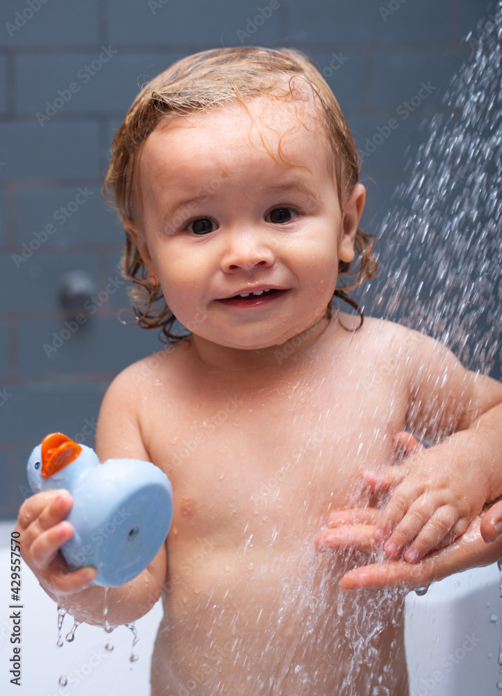 Bathing baby. Happy kid with soap foam on head. Kid shower. Bathing baby. Happy kid with soap foam on head. Kid shower.