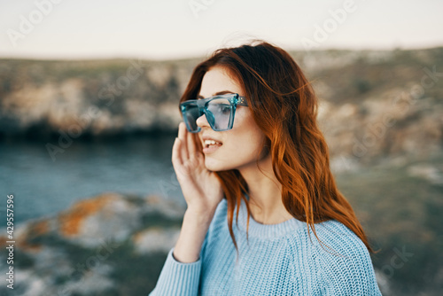 cheerful pretty woman in blue glasses outdoors travel luxury