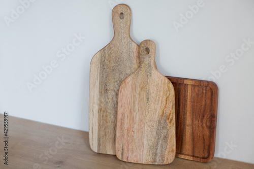 Various wooden cutting boards on kitchen