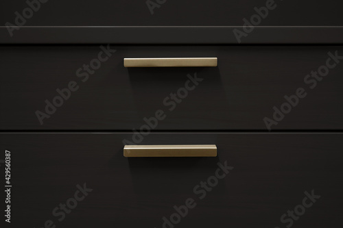 Image of a black chest of drawers