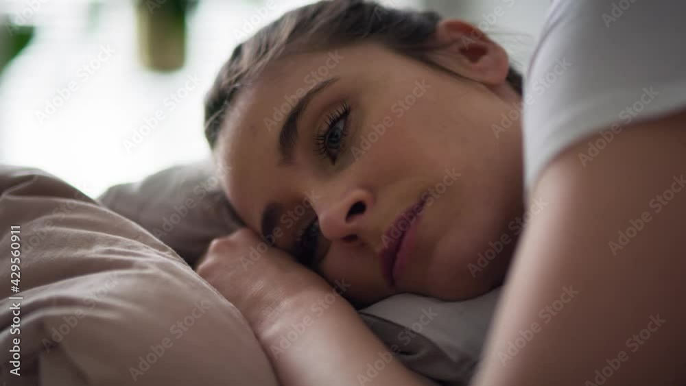 Close up video of sad woman lying down. Shot with RED helium camera in 8K. Close up video of sad woman lying down. Shot with RED helium camera in 8K.