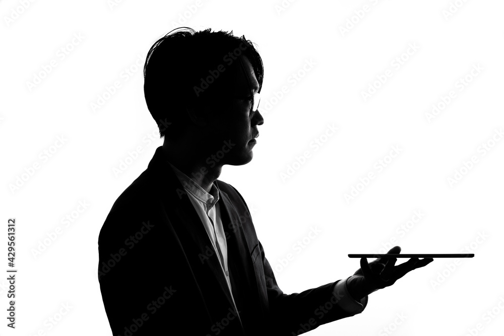 Silhouette of businessman use tablet isolate on  white background. Concept for business and online technology.