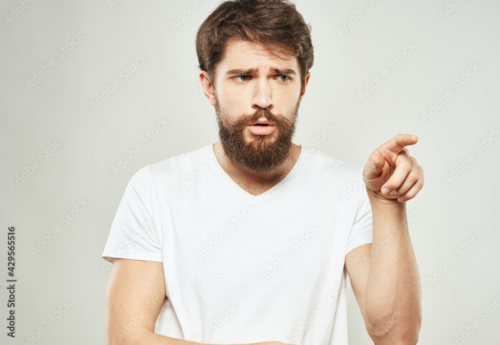 Sad guy with bushy beard gestures with his hands Copy Space cropped view Sad guy with bushy beard gestures with his hands Copy Space cropped view