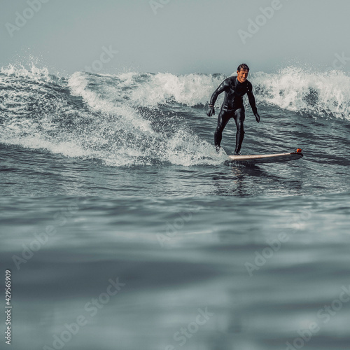 Surfer on wave in Devon