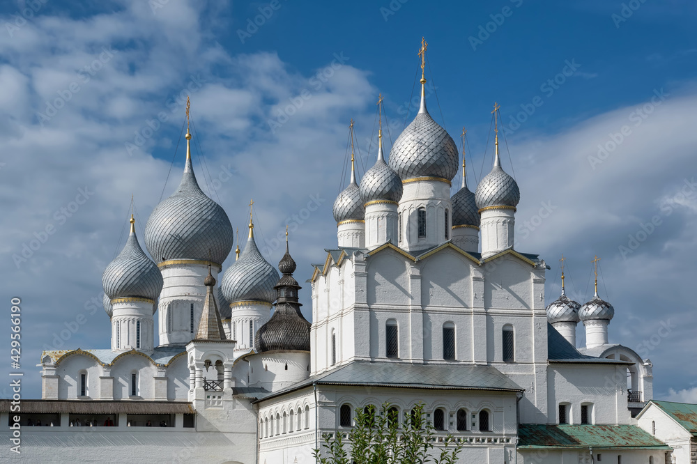 View of Assumption Cathedral (Uspensky cathedral, left) and Resurrection Church (Voskresenskaya church, right) on sunny summer day. Rostov Kremlin, Yaroslavl Oblast, Russia.