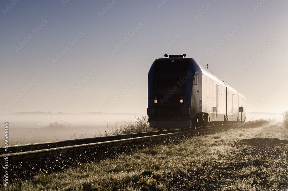 Obraz premium REGIONAL TRAIN - Passenger vehicle on a railroad 