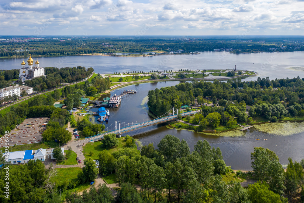 Aerial view of Volga and Kotorosl rivers confluence, Damansky bridge and Strelka park on sunny summer day. Yaroslavl, Yaroslavl Oblast, Russia..