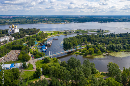 Aerial view of Volga and Kotorosl rivers confluence, Damansky bridge and Strelka park on sunny summer day. Yaroslavl, Yaroslavl Oblast, Russia..