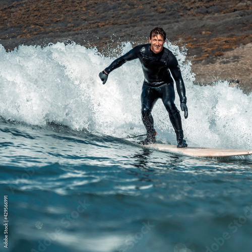 Man surfing a wave in Devon © Adam