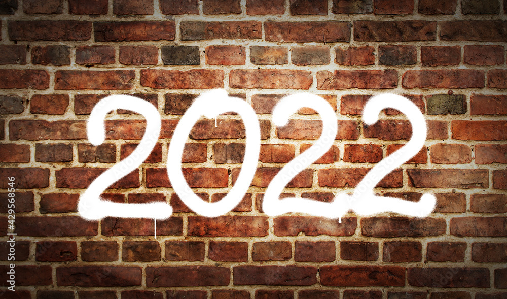 2022 year sign spray painted on the brick wall 2022 year sign spray painted on the brick wall