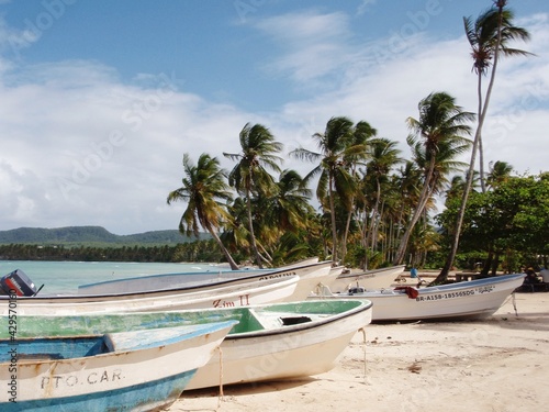 wooden fishing boats on a tropical beach