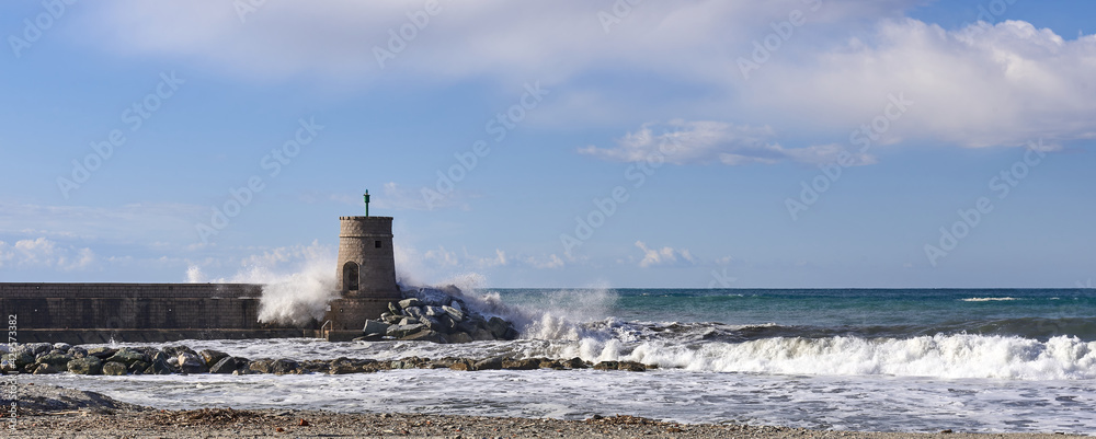 storm surge on the beach and pier of Recco, Liguria, Italy