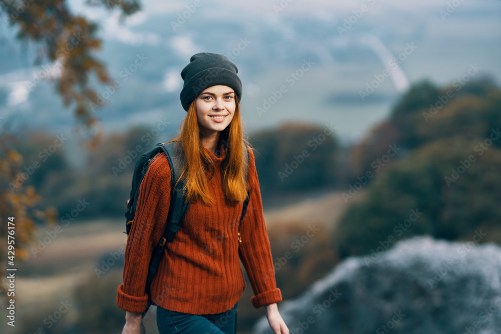 cheerful woman with backpack landscape mountains travel vacation