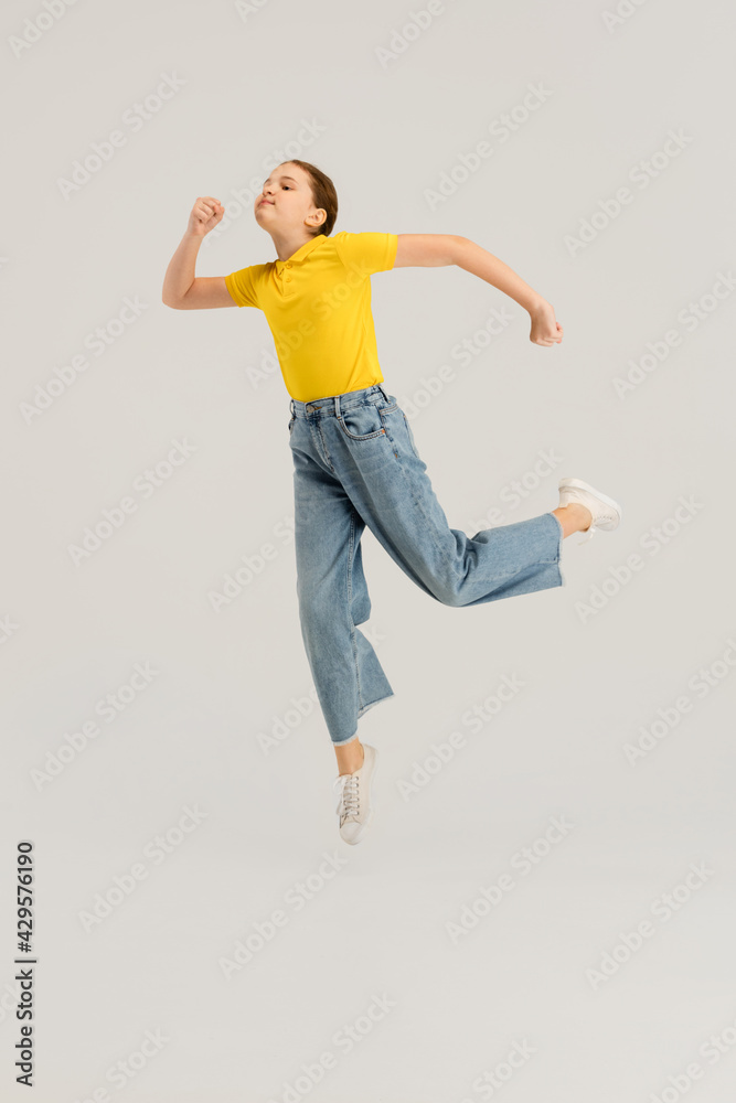 Caucasian girl isolated on white studio background. Copyspace. Childhood, education, emotions concept Caucasian girl isolated on white studio background. Copyspace. Childhood, education, emotions concept