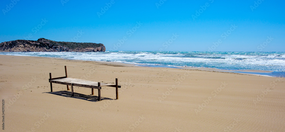 wooden seat near the sea at the beach