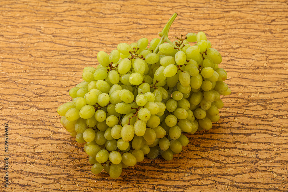 Green grape branch over background Green grape branch over background