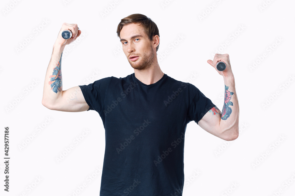 man with dumbbells muscles muscles bodybuilder fitness and tattoo on his arm man with dumbbells muscles muscles bodybuilder fitness and tattoo on his arm