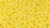Pasta. Yellow background. Food picture.