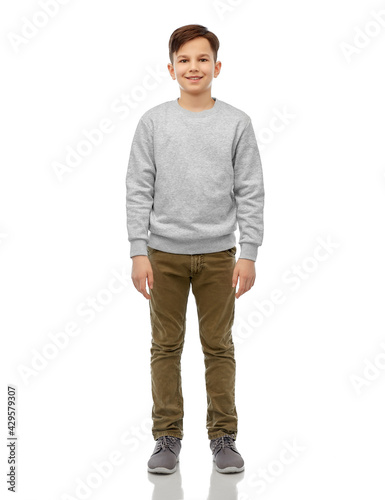 Obraz na plátne childhood, fashion and people concept - portrait of happy smiling boy over grey