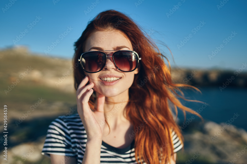 happy traveler in sunglasses in the mountains fresh air landscape happy traveler in sunglasses in the mountains fresh air landscape