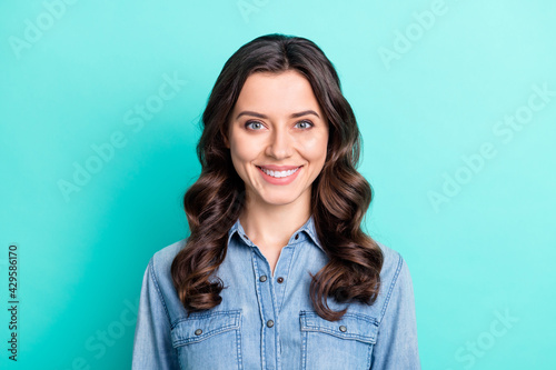 Photo of young attractive pretty girl happy positive toothy smile isolated over turquoise color background