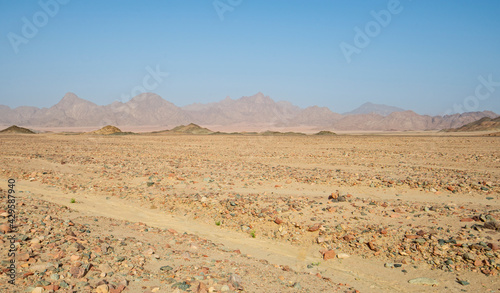 Barren rocky desert landscape in hot climate
