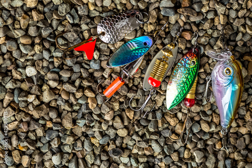 Spain.August 22, 2020.Fishing tackle - fishing spinning, lures and wobblers.Closeup of a fishing box with colorful lures.Fishing in Spain at the Mequinenza reservoir - Ebro photo