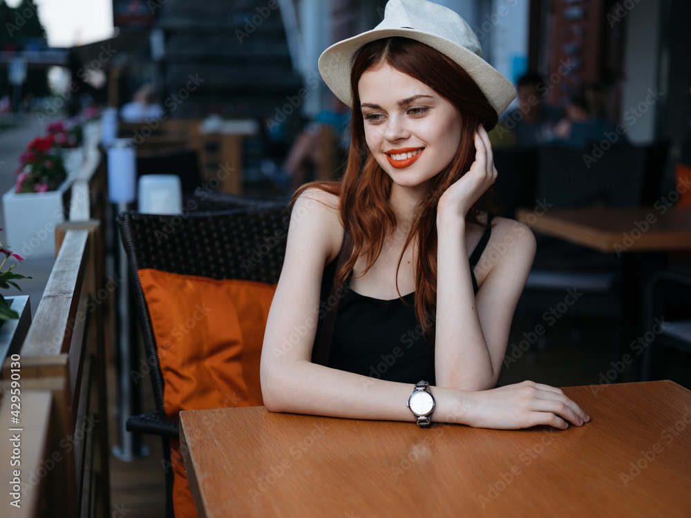 woman sitting at a table cafe on the street face makeup restaurant model woman sitting at a table cafe on the street face makeup restaurant model