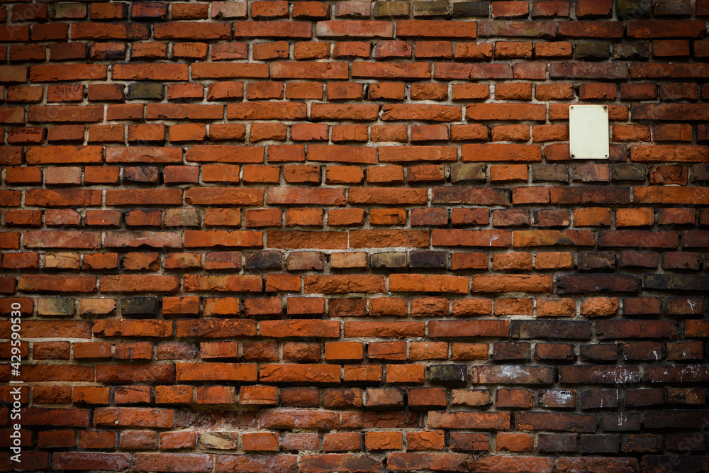 Brick wall red old weathered texture background. Grunge old house aged dark bricks.