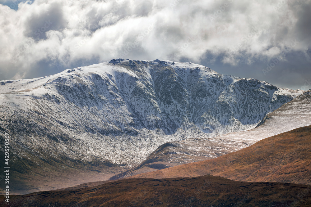 The snow covered ridge and summit of Meall Garbh in the winter Scottish Highlands, UK Landscapes.