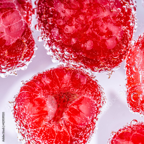 Raspberries in soda water photo