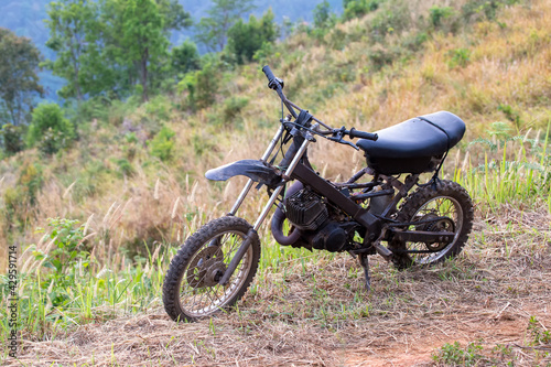 Modifying an old two-stroke motorbike with motocross tires For hiking and fun in the forest