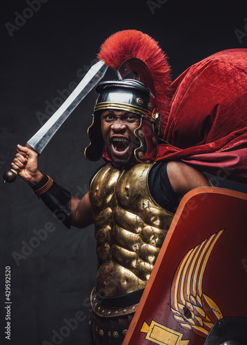 Angry ancient legionary attacks with sword