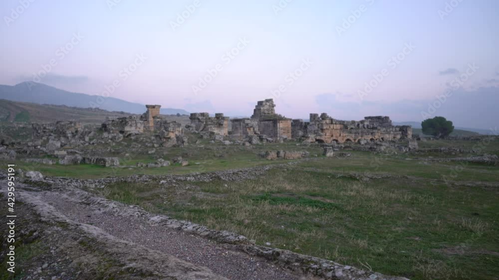 Pamukkale, Turkey - January 2021: Thermal springs. Steam over a thermal spring. Beautiful landscape at sunset Pamukkale, Turkey - January 2021: Thermal springs. Steam over a thermal spring. Beautiful landscape at sunset